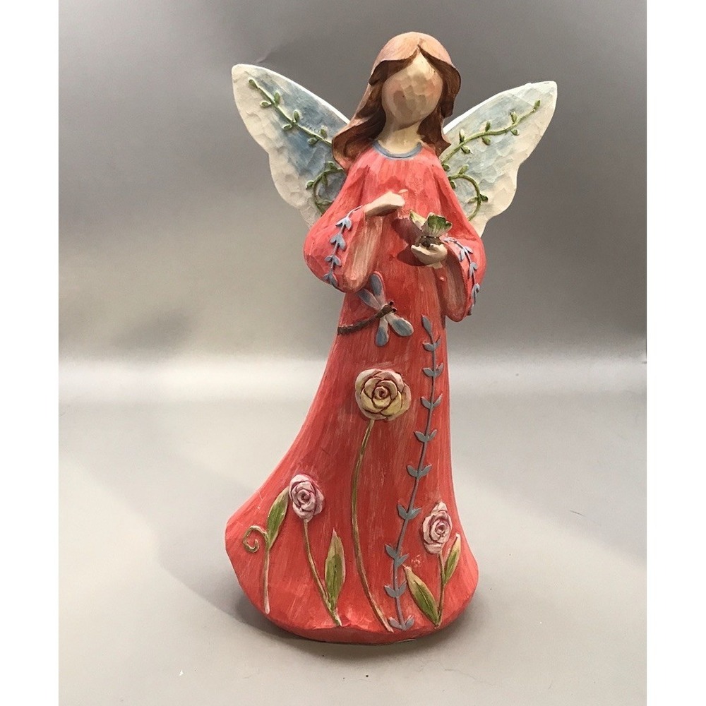 Wood Fairy Holding A Butterfly‎